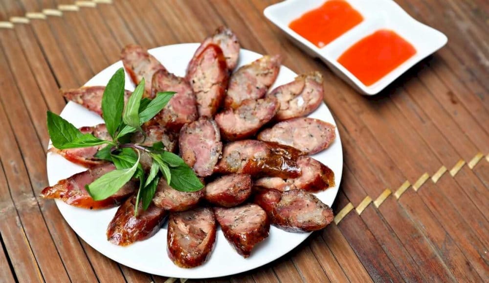 Sliced lap xuong served with chili sauce
